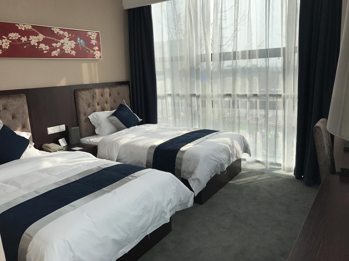 Hubei Airport Business Hotel Tianhe Airport Branch Ухань Экстерьер фото